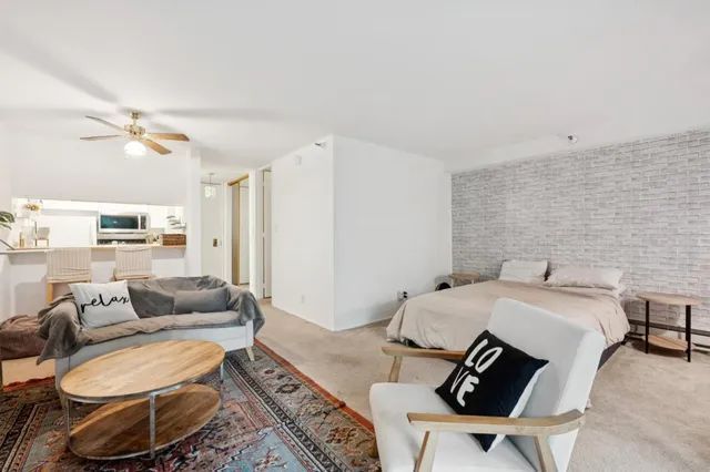 a living room with furniture and a rug