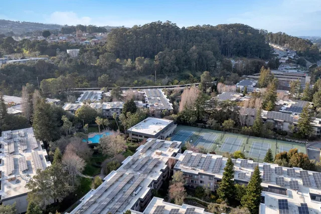 an aerial view of houses with yard