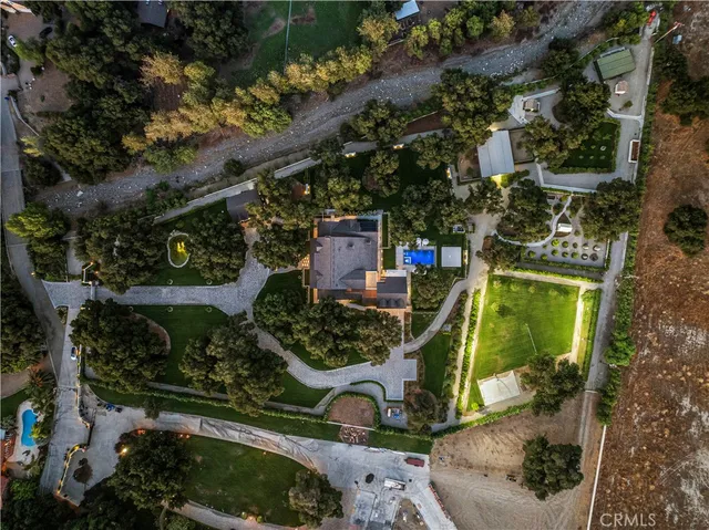 a living room with fireplace furniture and a wooden floor