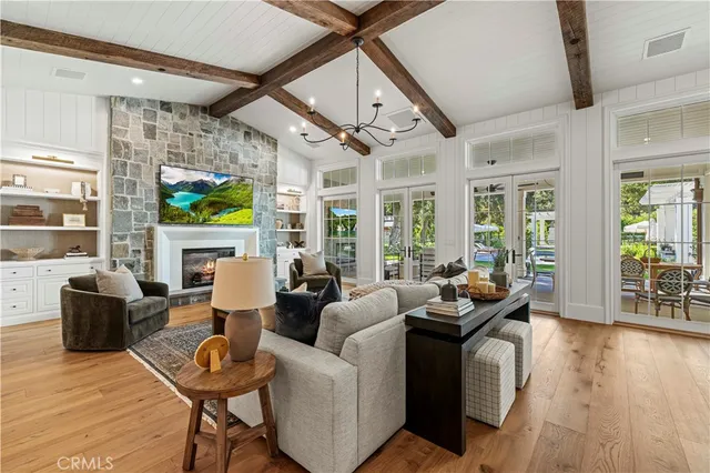 a kitchen with stainless steel appliances a stove a sink and a microwave