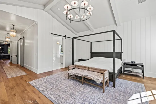 a front view of a house with garden and sitting area