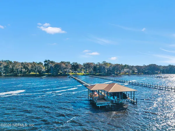a view of a lake with outside seating space