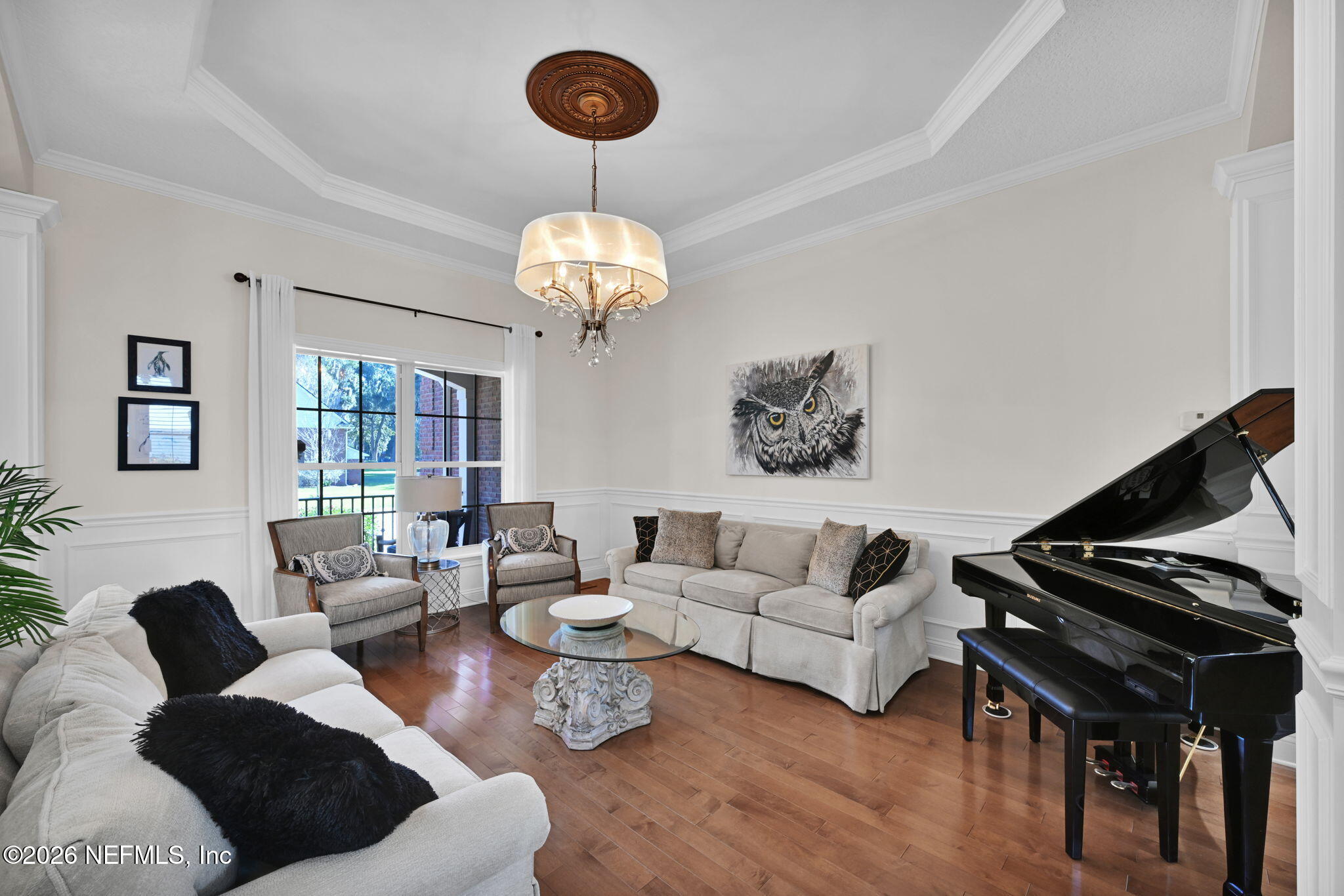 1050 Popolee Road St. Johns, FL 32259 - Photo 11 of 37 a living room with furniture or couch and a chandelier