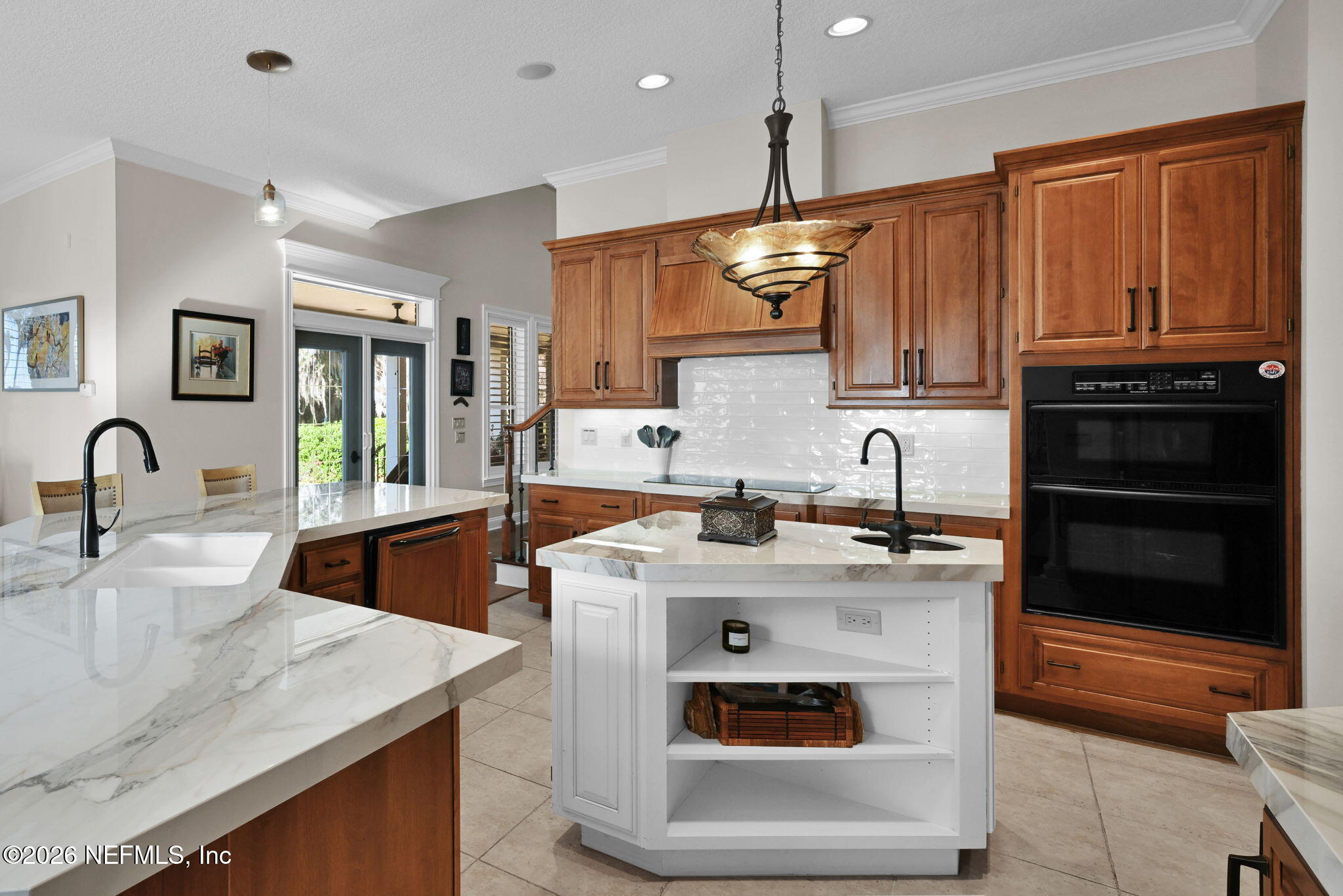 1050 Popolee Road St. Johns, FL 32259 - Photo 15 of 37 a kitchen with stainless steel appliances granite countertop a sink a stove and a wooden cabinets