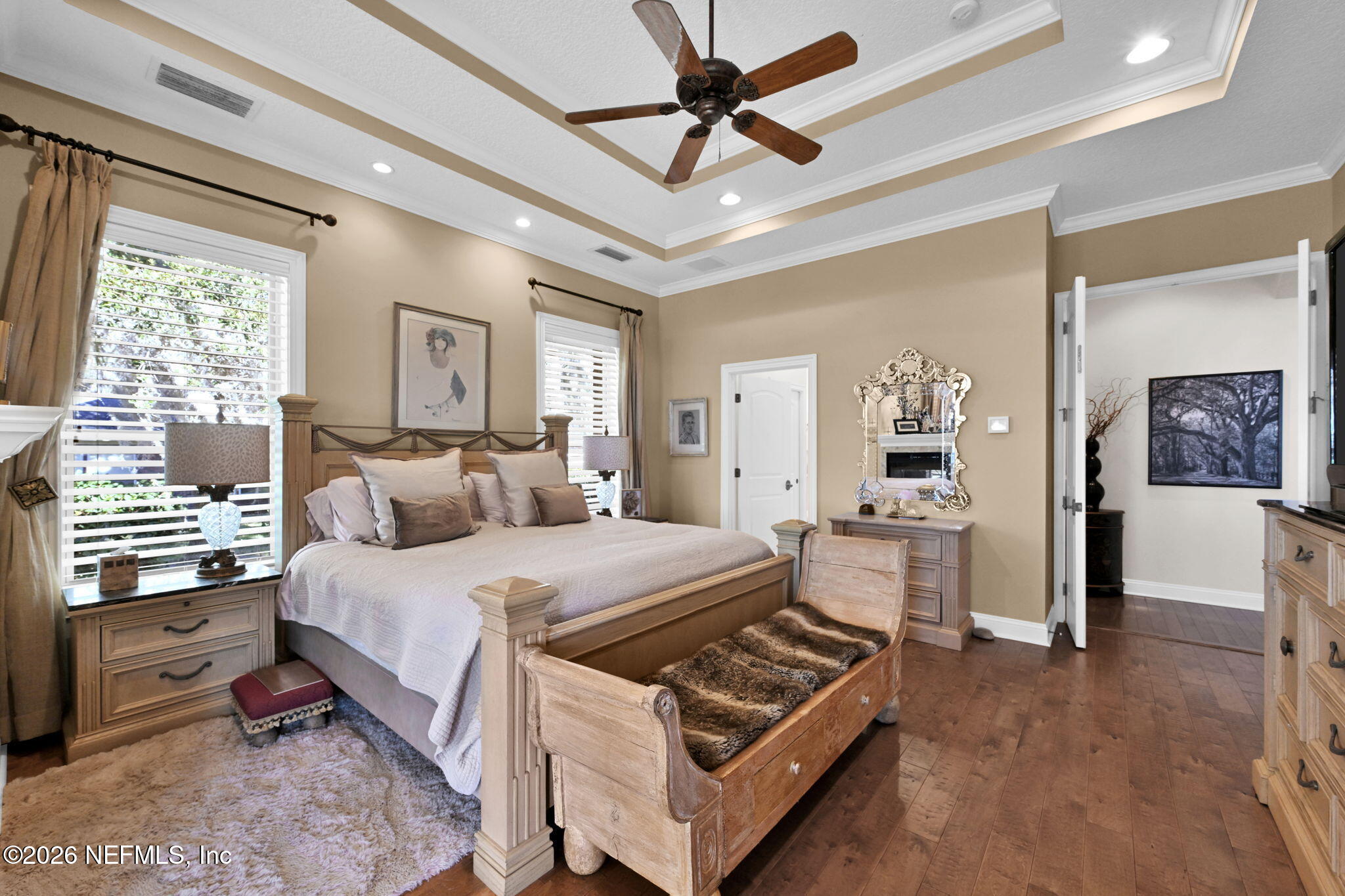 1050 Popolee Road St. Johns, FL 32259 - Photo 19 of 37 a bedroom with a bed and a chandelier