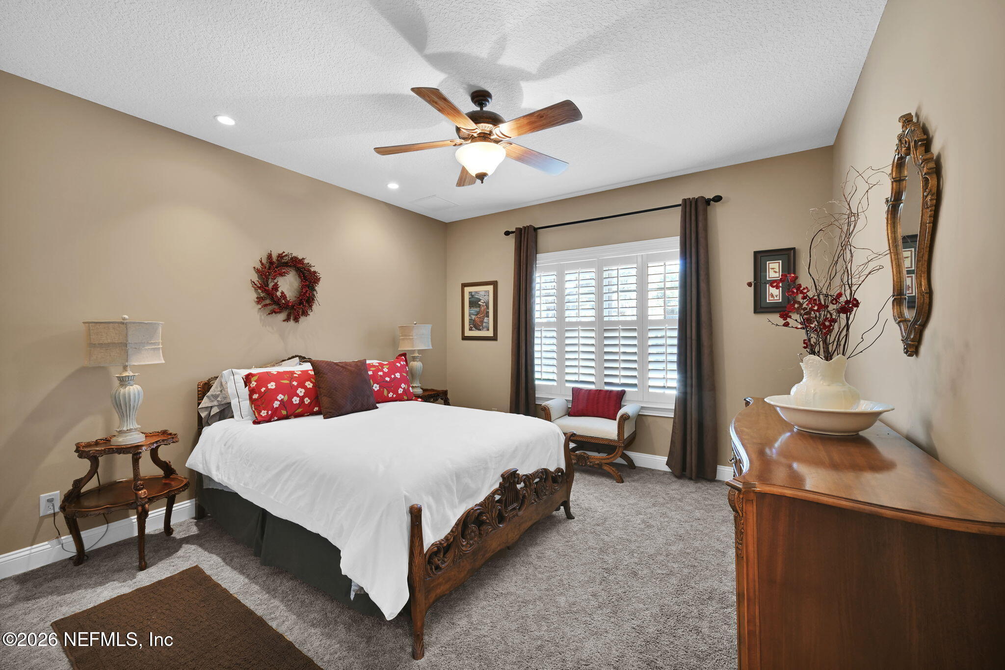 1050 Popolee Road St. Johns, FL 32259 - Photo 25 of 37 a bedroom with a bed and a chandelier