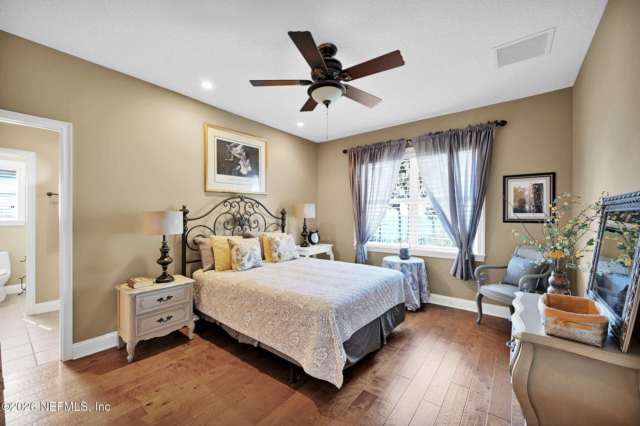 1050 Popolee Road St. Johns, FL 32259 - Photo 27 of 37 a bedroom with a bed and wooden floor