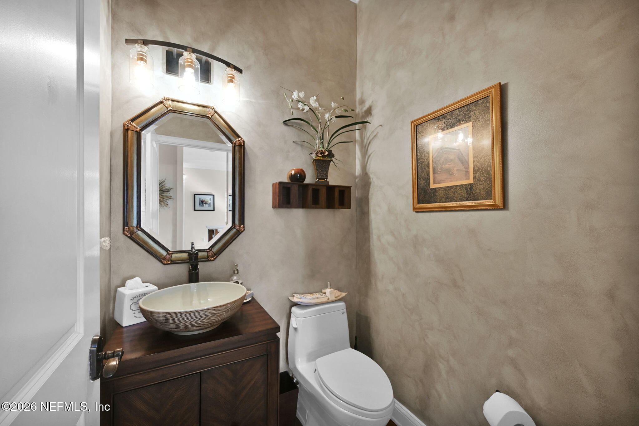 1050 Popolee Road St. Johns, FL 32259 - Photo 30 of 37 a bathroom with a toilet a sink and mirror