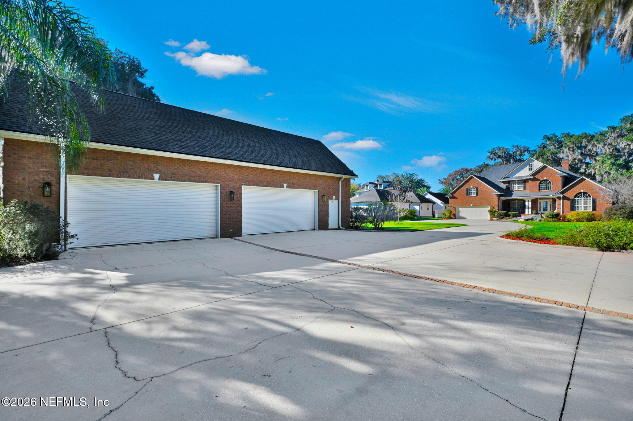 1050 Popolee Road St. Johns, FL 32259 - Photo 33 of 37 a front view of a house with a yard and garage