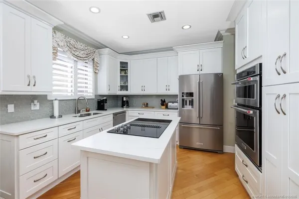 a bathroom with a double vanity sink mirror and shower