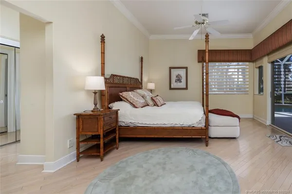 a swimming pool with outdoor seating and windows