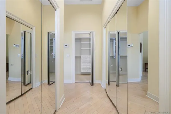 a living room with furniture and large windows