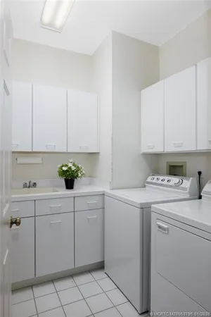 an aerial view of a houses with a lake view