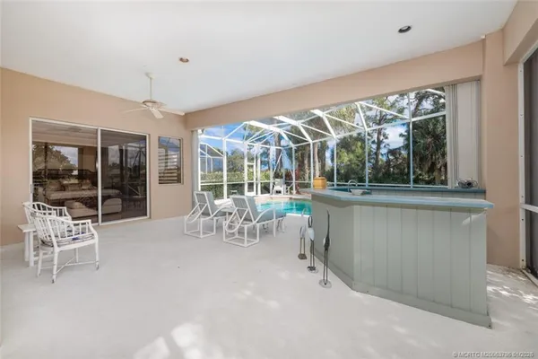 an aerial view of a house with garden space and outdoor seating