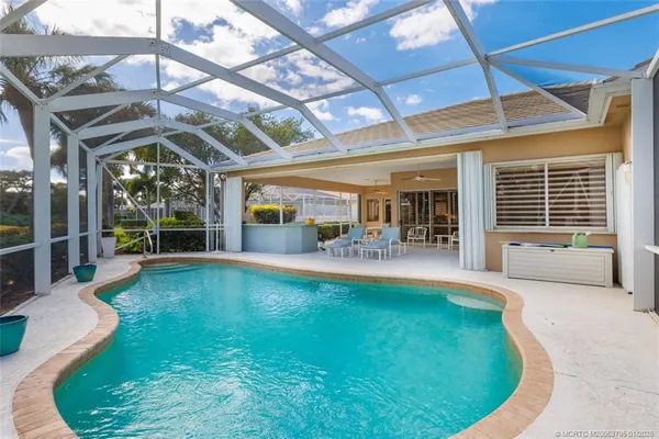 a view of a swimming pool with a garden