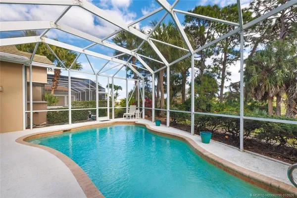 a view of a patio with swimming pool