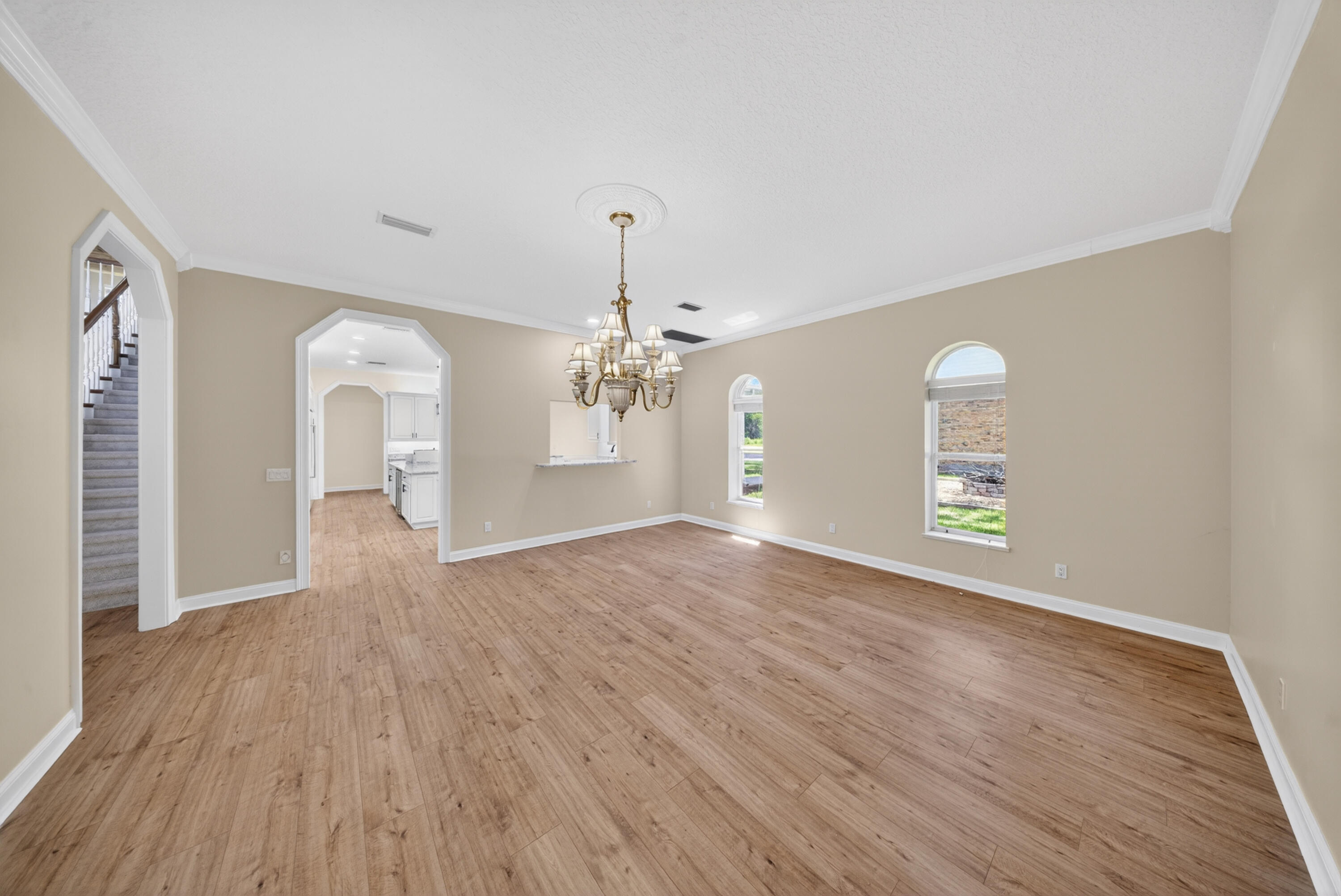8686 Andrews Avenue Fort Pierce, FL 34945 - Photo 36 of 76 wooden floor in an empty room with a window