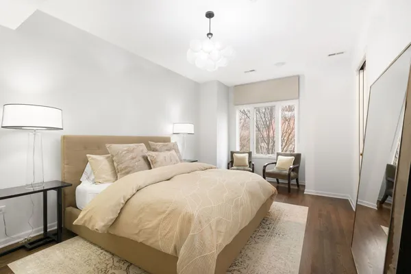 a bedroom with bed and a window