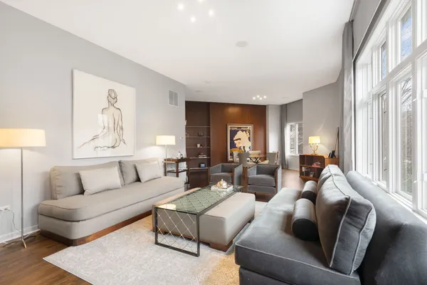 a living room with furniture and a large window