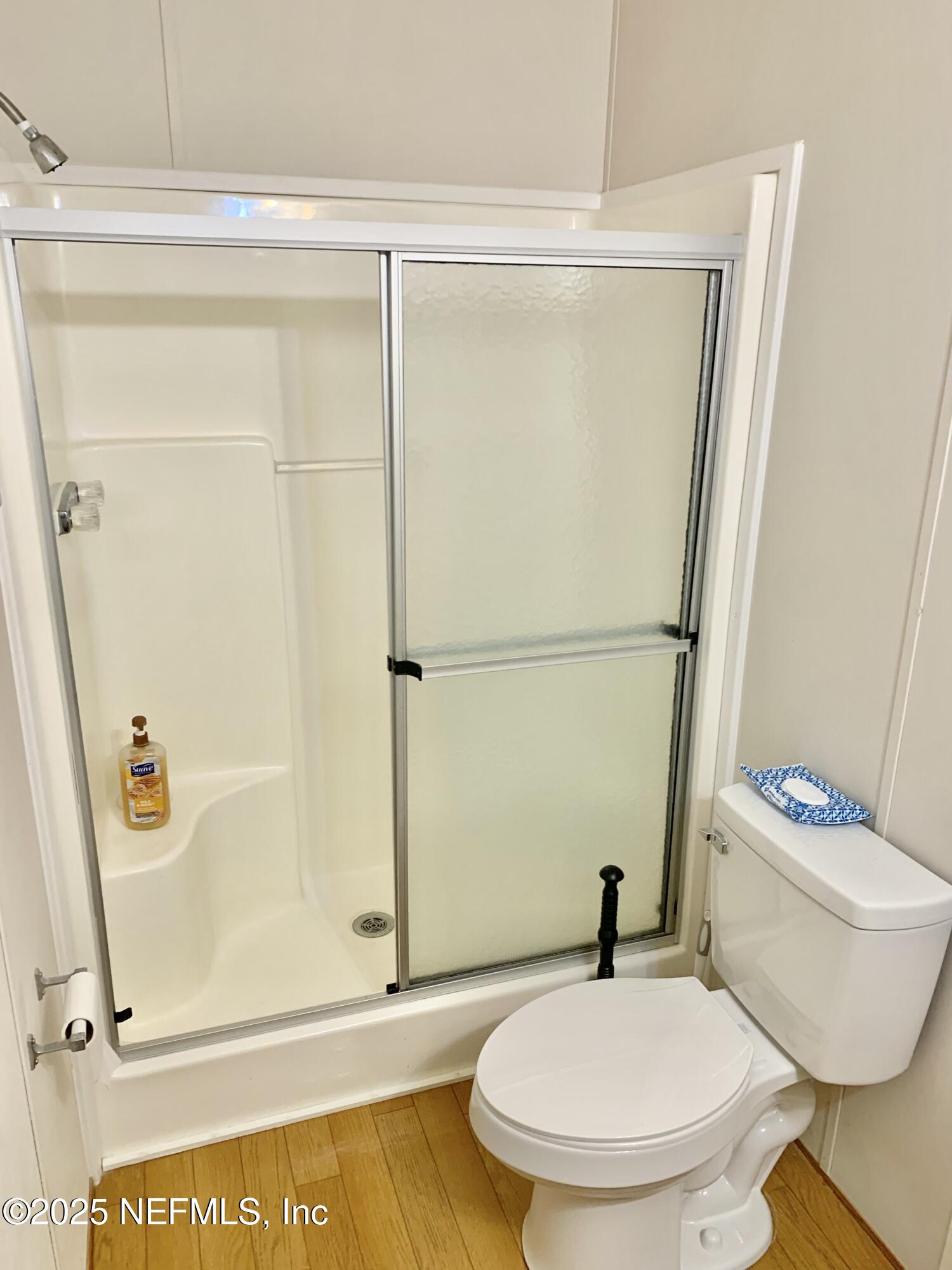 12752 Southeast 9th Place Gainesville, FL 32641 - Photo 32 of 53 a bathroom with a toilet and a shower