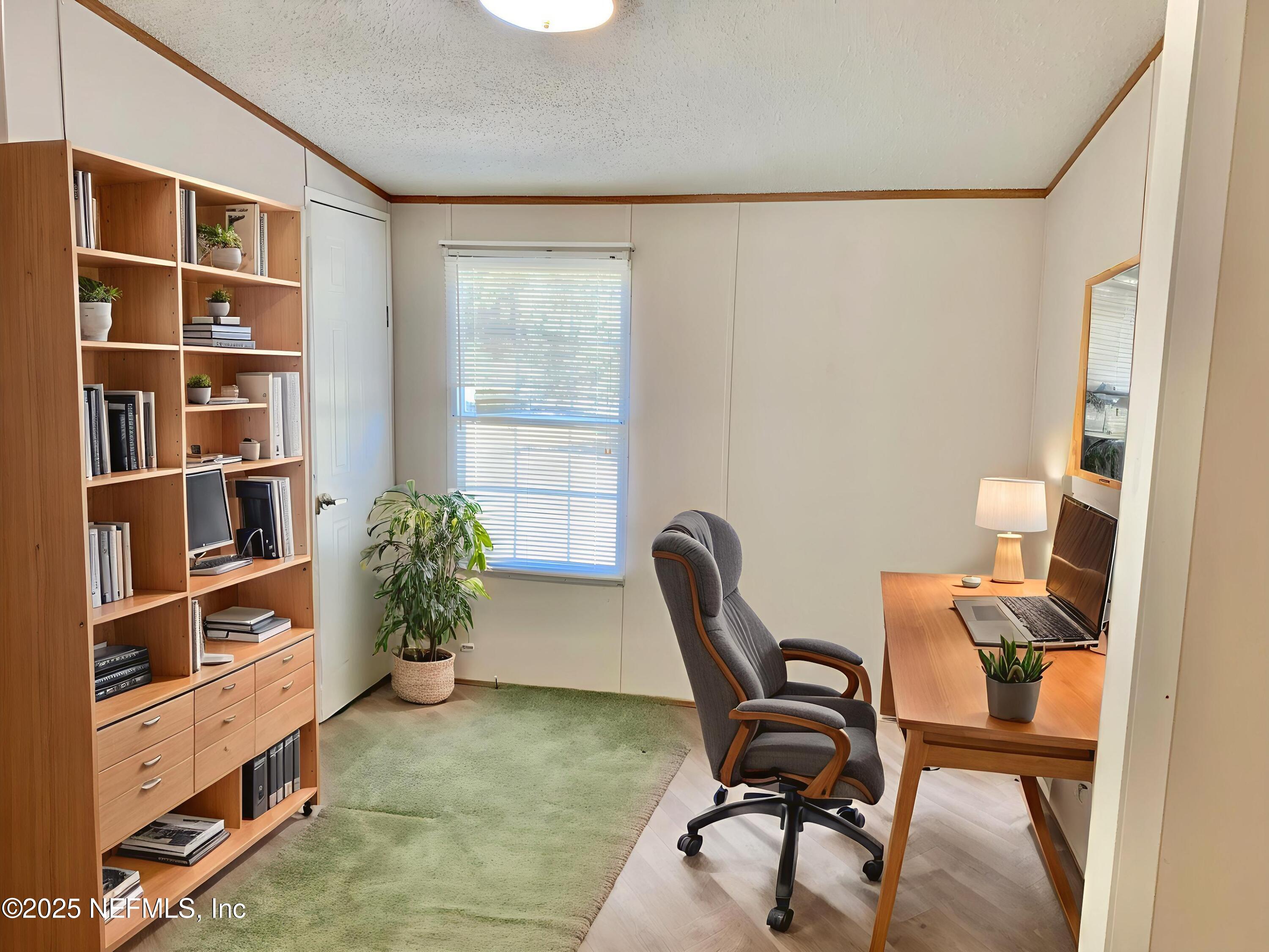 12752 Southeast 9th Place Gainesville, FL 32641 - Photo 34 of 53 a view of a workspace with furniture and a window