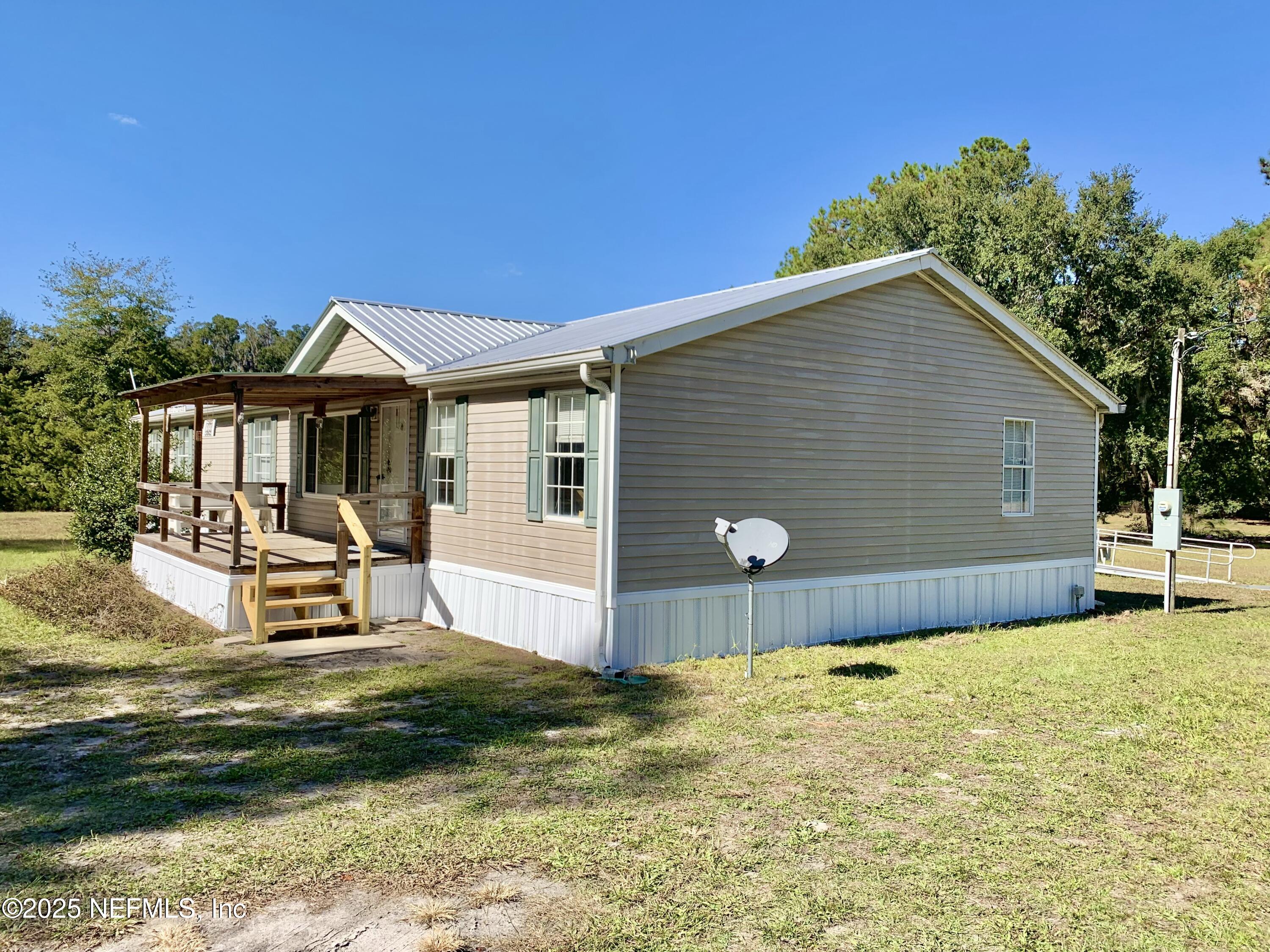 12752 Southeast 9th Place Gainesville, FL 32641 - Photo 46 of 53 a front view of a house with garden