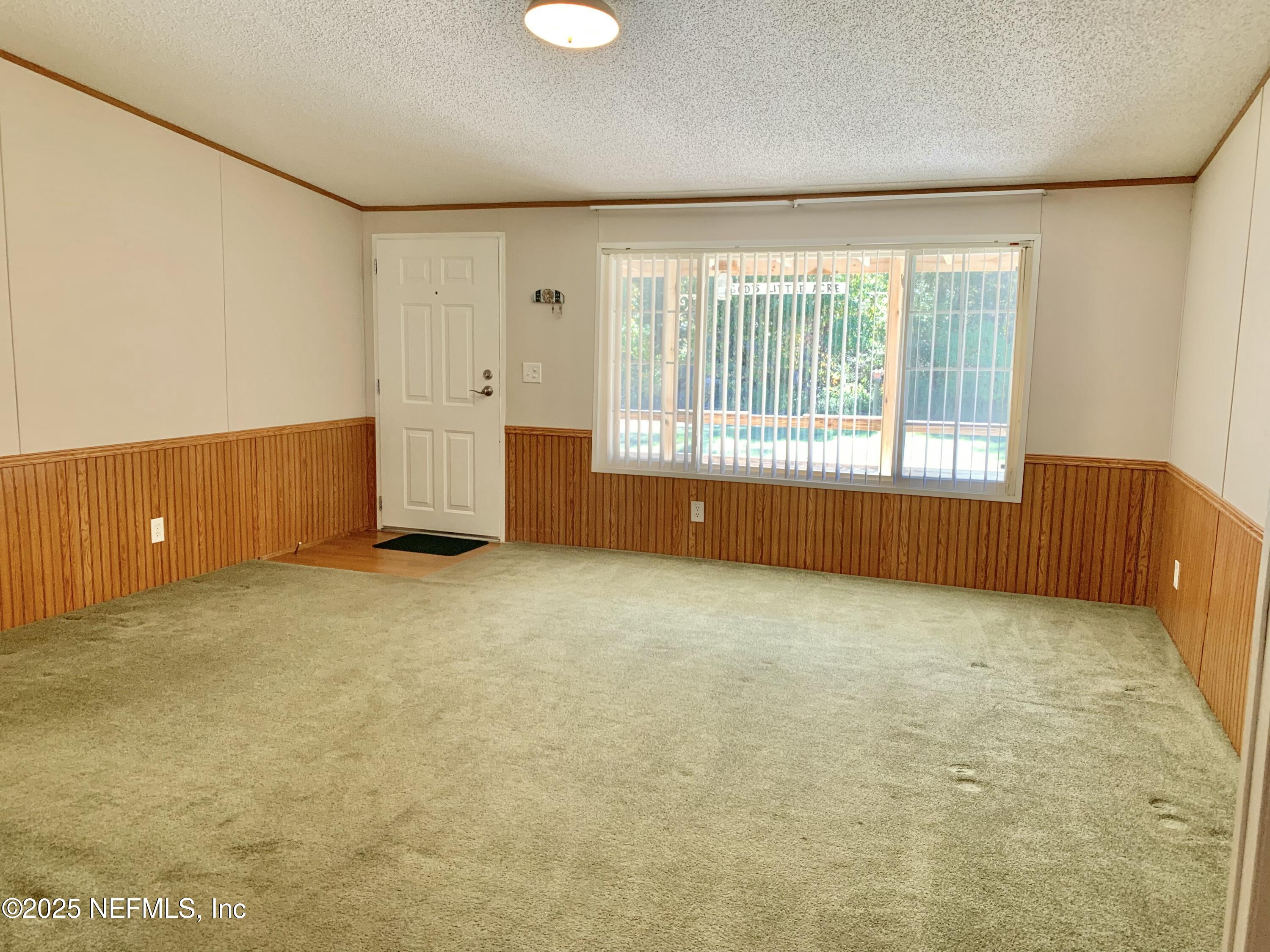 12752 Southeast 9th Place Gainesville, FL 32641 - Photo 5 of 53 a view of an empty room with a window