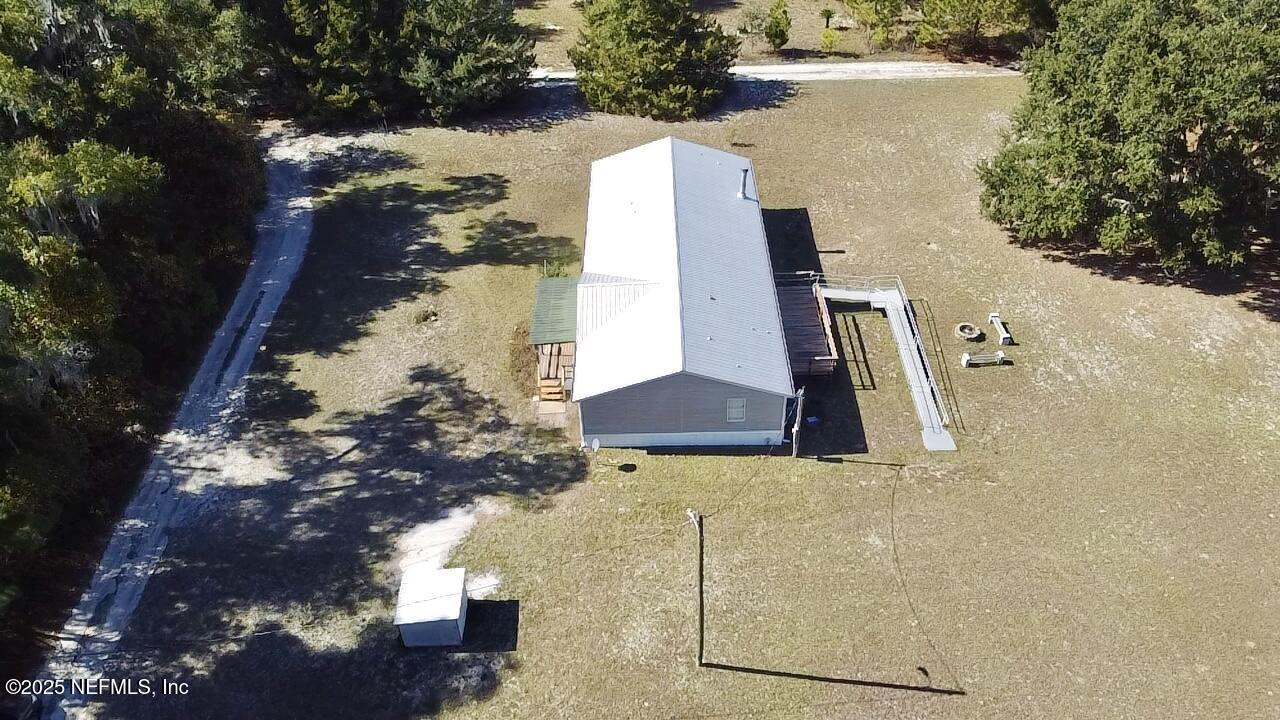 12752 Southeast 9th Place Gainesville, FL 32641 - Photo 51 of 53 a view of a house with a yard