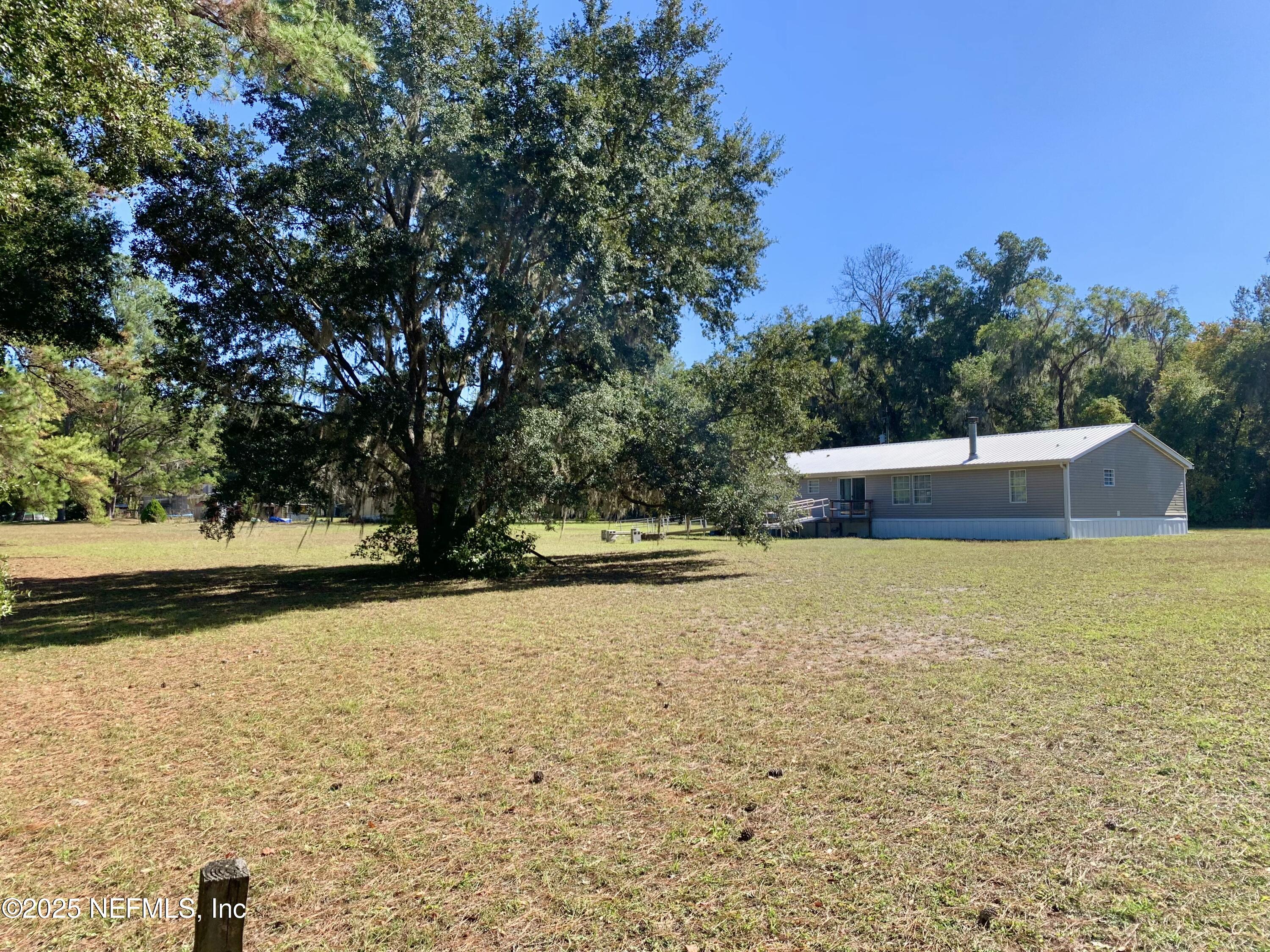 12752 Southeast 9th Place Gainesville, FL 32641 - Photo 53 of 53 a house view with swimming pool in front of it