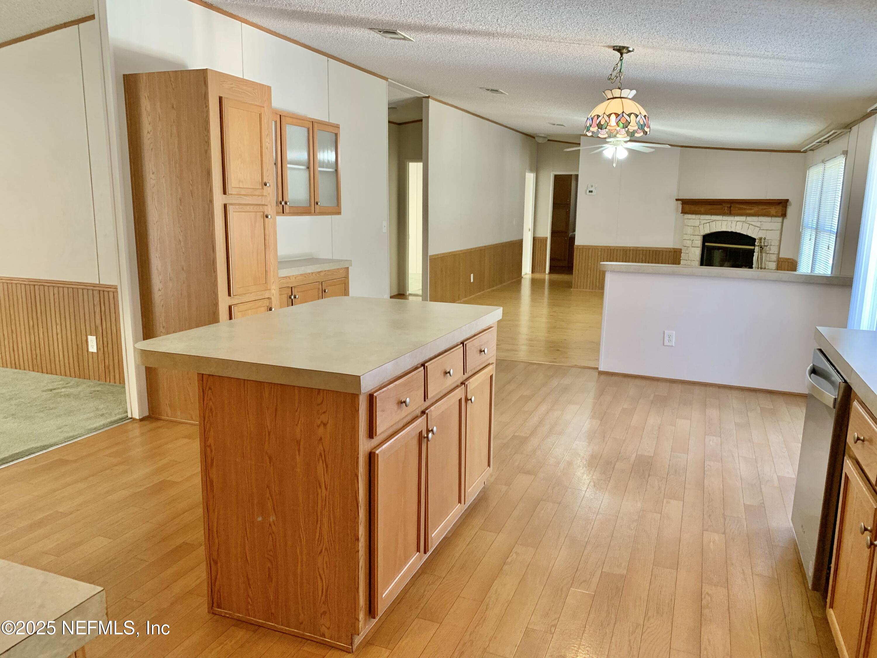 12752 Southeast 9th Place Gainesville, FL 32641 - Photo 9 of 53 a spacious bathroom with a granite countertop sink a mirror and a shower