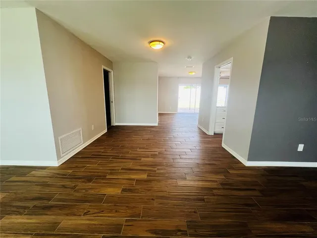 a view of a livingroom with wooden floor