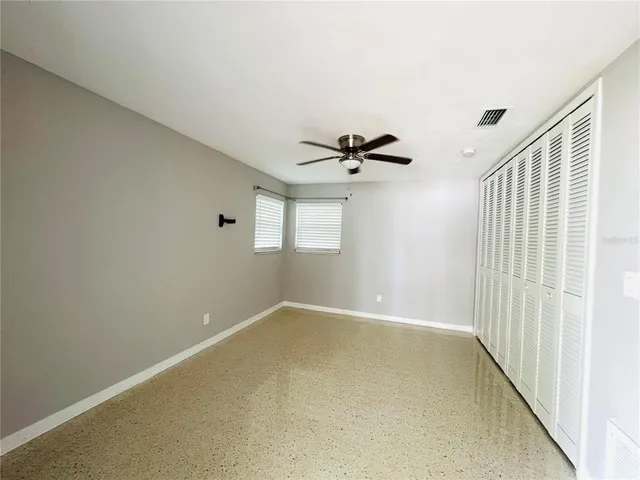 a view of an empty room with a window