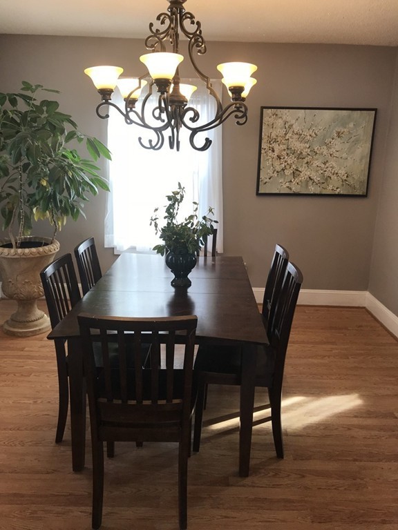 15 Strong Street Springfield, MA 01104 - Photo 7 of 28 a view of a dining room with furniture and wooden floor
