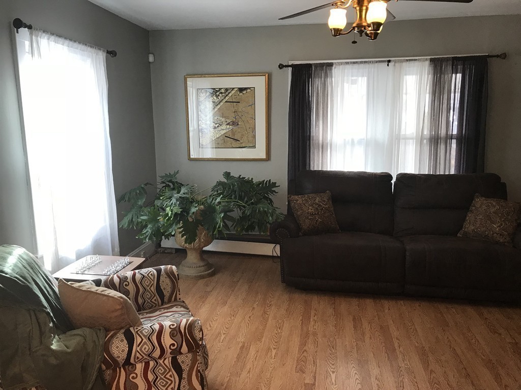 15 Strong Street Springfield, MA 01104 - Photo 9 of 28 a living room with furniture and a large window