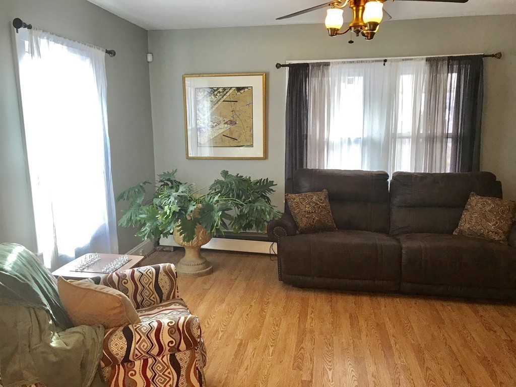 15 Strong Street Springfield, MA 01104 - Photo 10 of 28 a living room with furniture and a large window