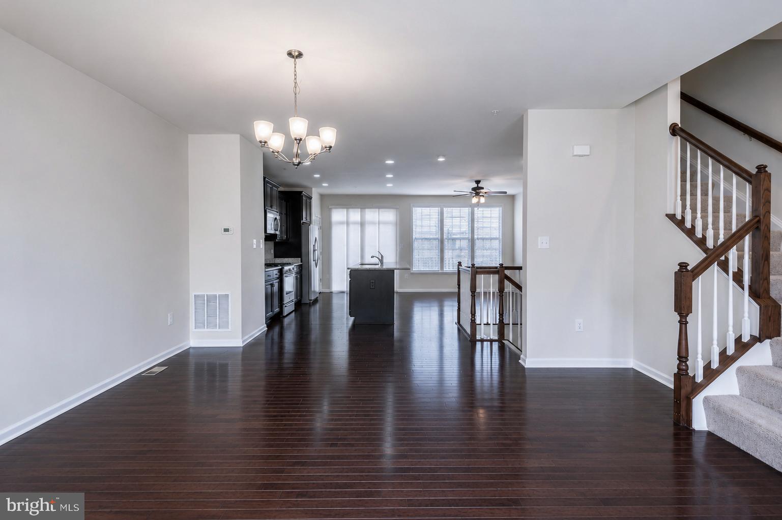 4731 Cambria Road Frederick, MD 21703 - Photo 25 of 63 a view of a dining room with furniture and wooden floor