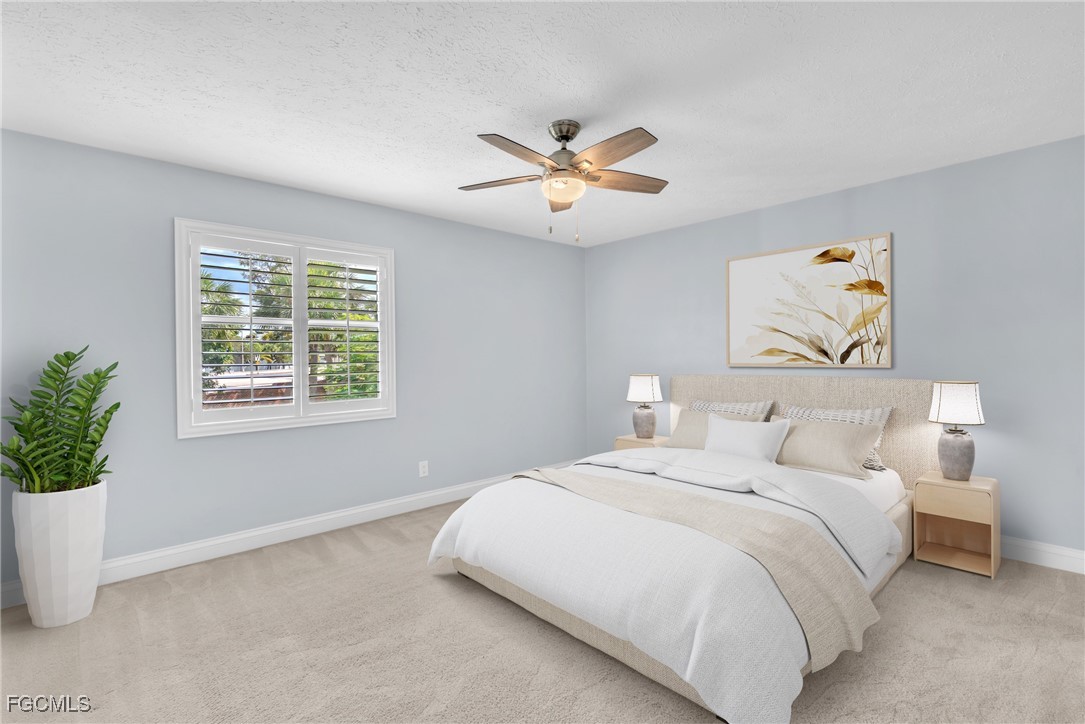 1526 Trafalgar Lane, Unit B Naples, FL 34116 - Photo 16 of 33 a bedroom with a bed and a window