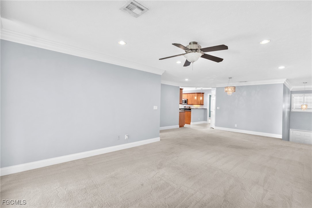 1526 Trafalgar Lane, Unit B Naples, FL 34116 - Photo 22 of 33 an empty room with ceiling fan and window