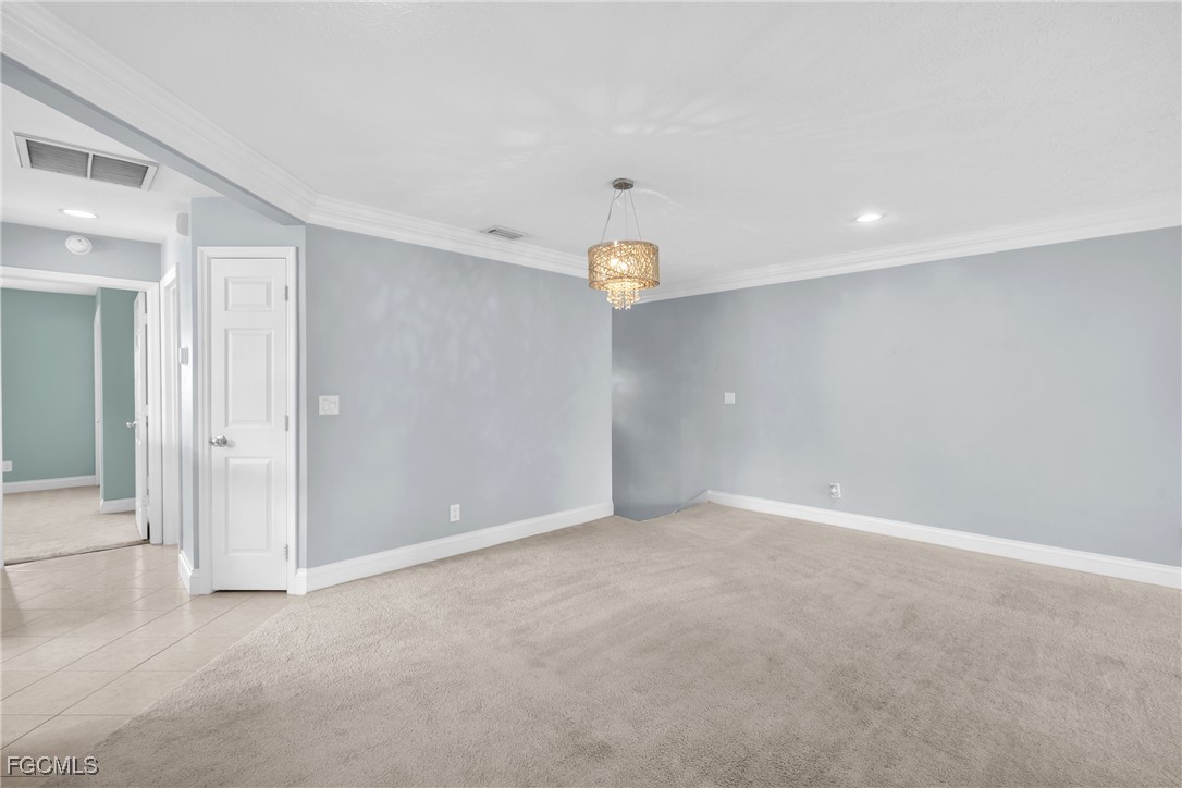 1526 Trafalgar Lane, Unit B Naples, FL 34116 - Photo 24 of 33 an empty room with window and mirror