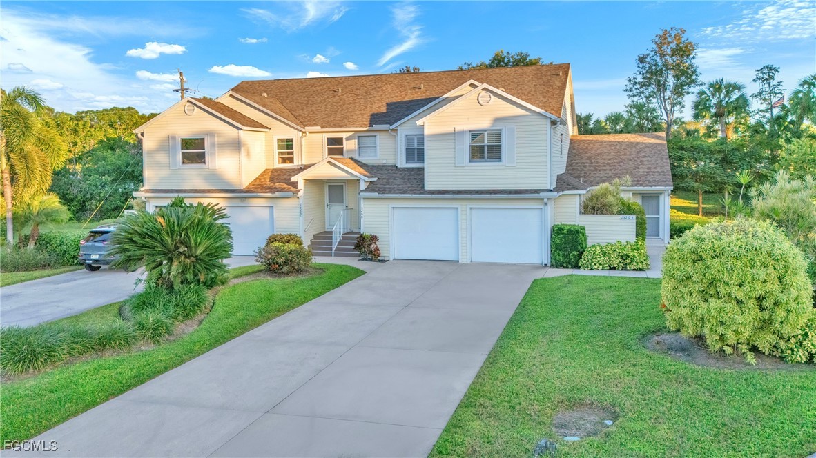 1526 Trafalgar Lane, Unit B Naples, FL 34116 - Photo 30 of 33 a front view of a house with a yard