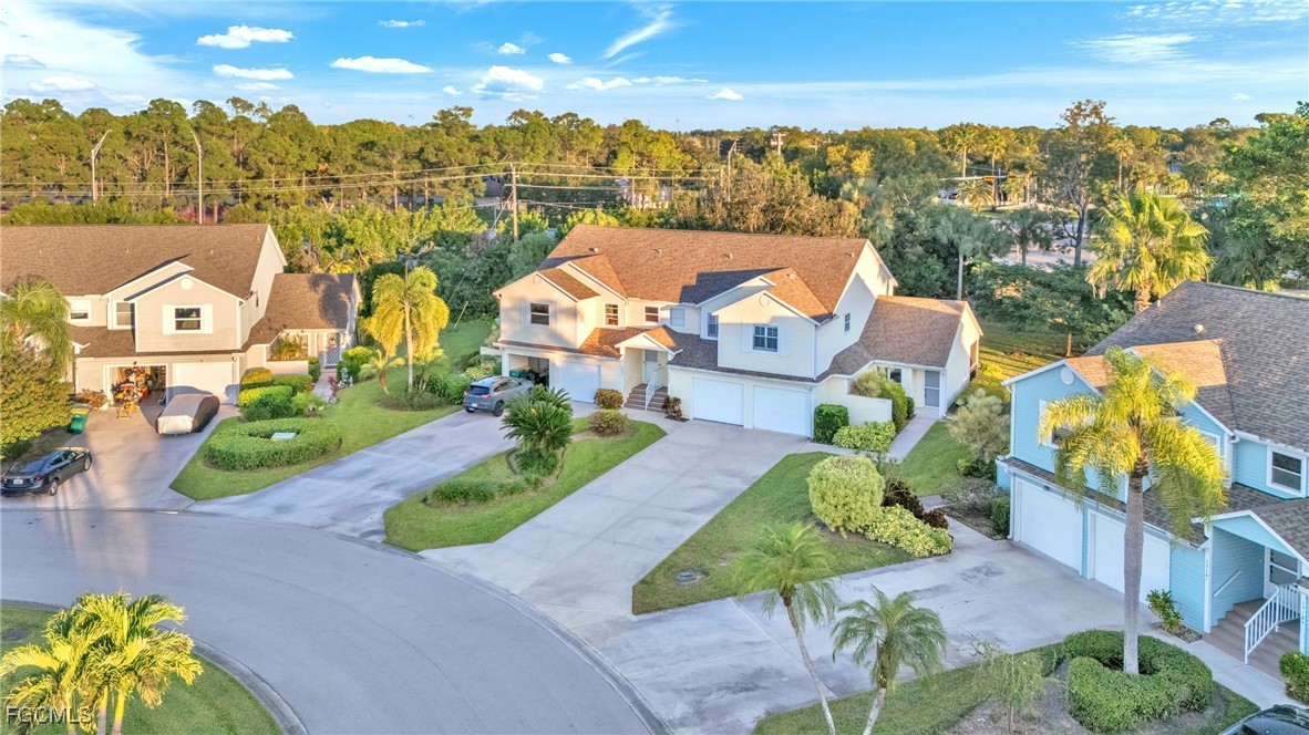 1526 Trafalgar Lane, Unit B Naples, FL 34116 - Photo 31 of 33 an aerial view of residential houses with outdoor space and parking