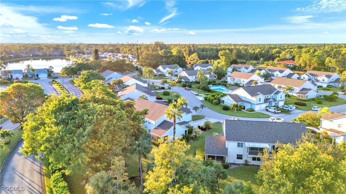 1526 Trafalgar Lane, Unit B Naples, FL 34116 - Photo 32 of 33 an aerial view of a city with lots of residential buildings ocean and mountain view in back