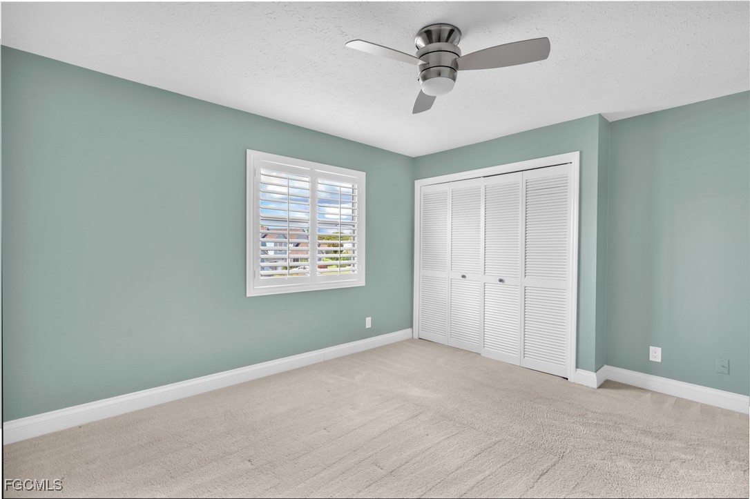 1526 Trafalgar Lane, Unit B Naples, FL 34116 - Photo 9 of 33 a view of an empty room with a window