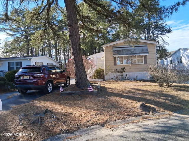 a view of a car in front of a house