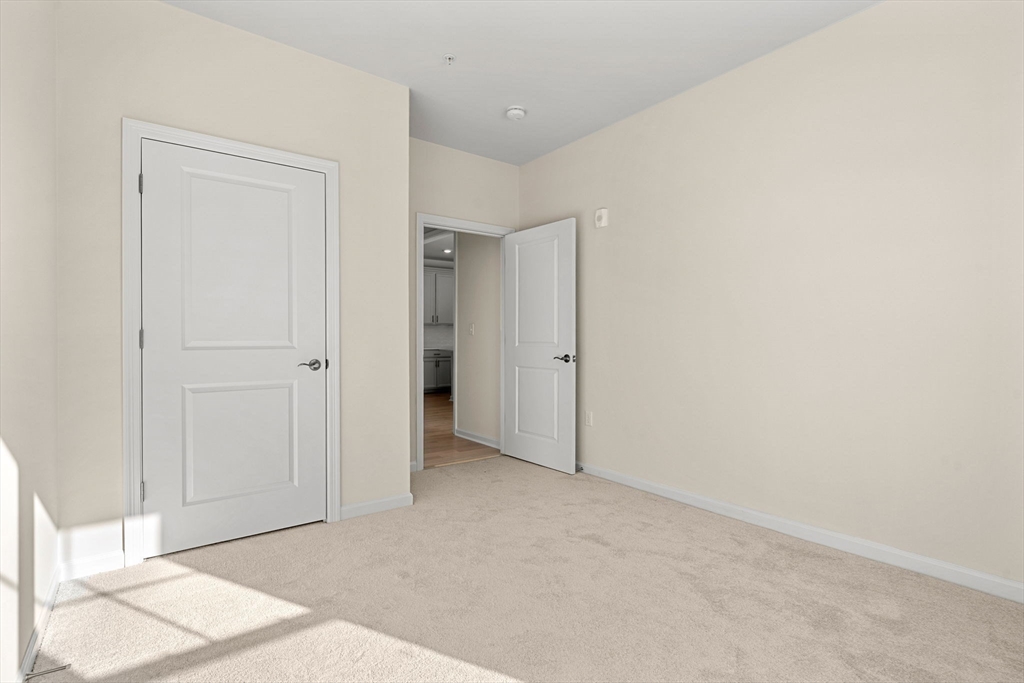 2 Stratton Drive, Unit 102 Woburn, MA 01801 - Photo 23 of 32 a view of an empty room