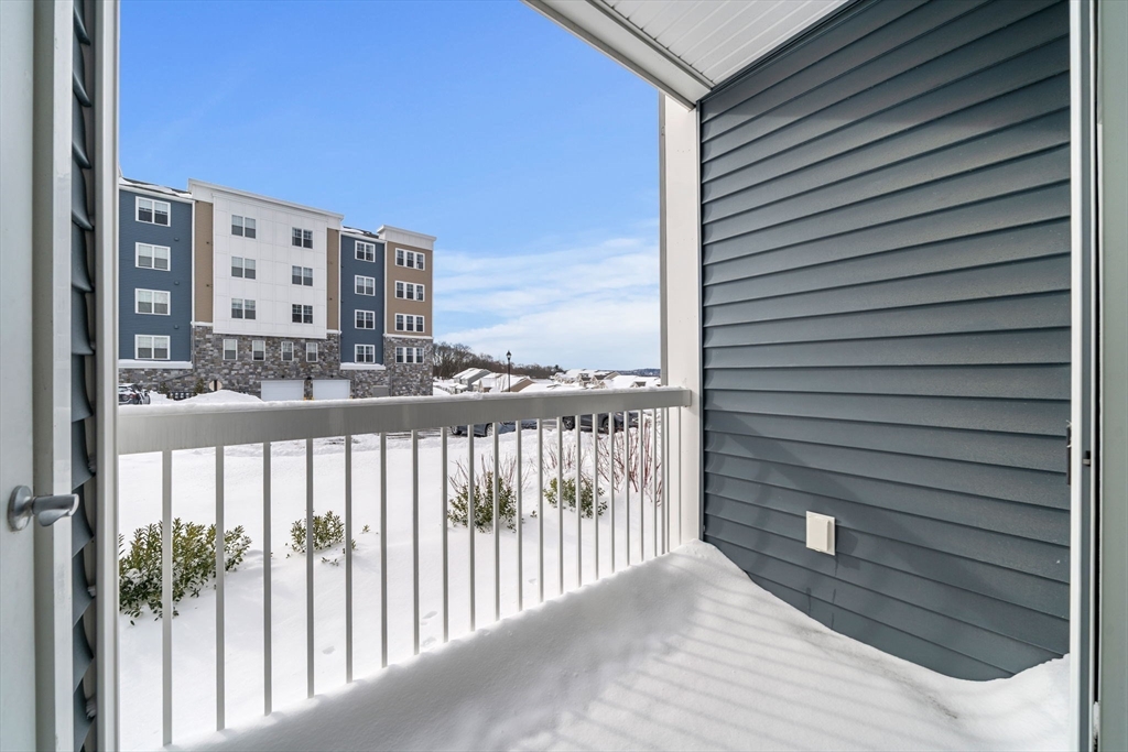 2 Stratton Drive, Unit 102 Woburn, MA 01801 - Photo 27 of 32 a view of a balcony