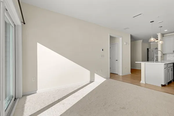 a view of a kitchen from the hallway