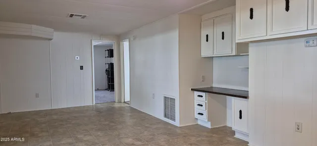 a view of a lake with a house in the background