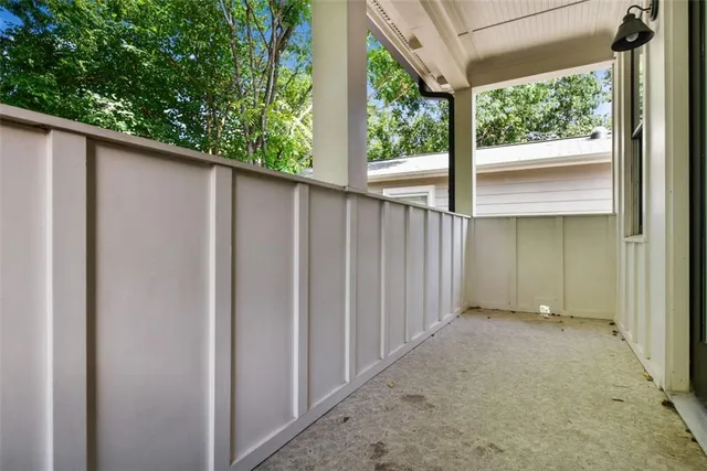 a view of a patio with table and chairs and potted plants