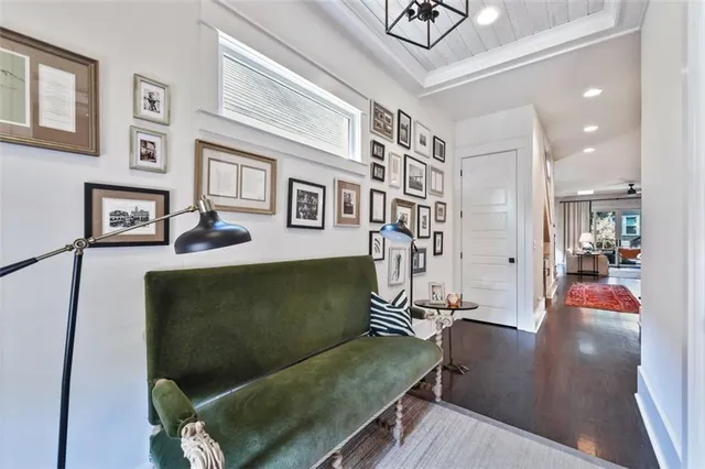 a living room with furniture a dining table and a window